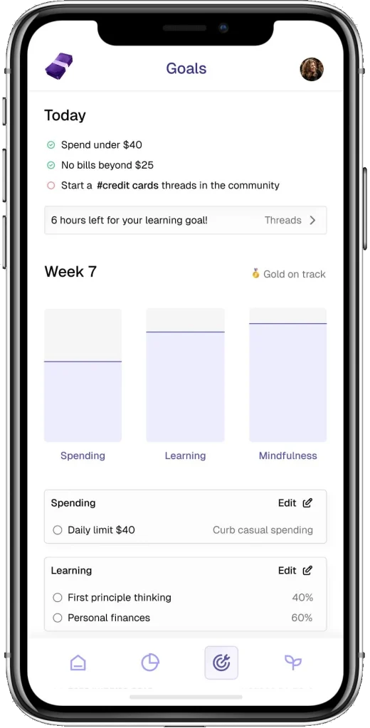 Goals screen with today's goals and a weekly balance across spending, learning and mindfulness