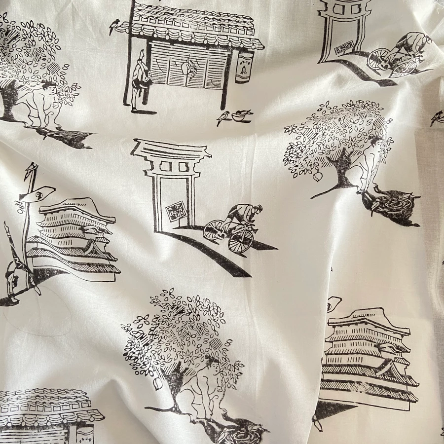 Print fabric detail — torii gate and pagoda motifs