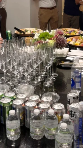 Glasses and bottled water on a catering table